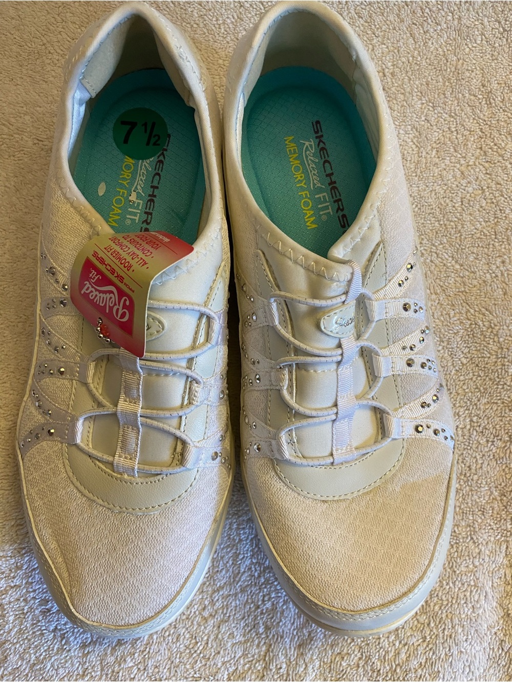 Skechers Women's White Slip-On Sneakers with Teal Insole and Rhinestones